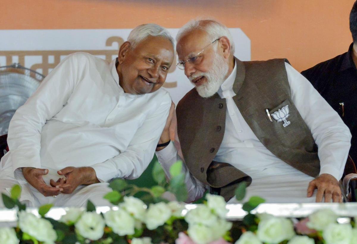 Prime Minister Narendra Modi and Bihar Chief Minister Nitish Kumar Yadav interact during Bihar assembly elections rally, in Samastipur Prime Minister Narendra Modi and Bihar Chief Minister Nitish Kumar Yadav interact during Bihar assembly elections rally, in Samastipur